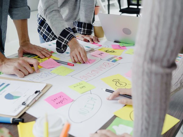 group-casually-dressed-business-people-discussing-ideas-office.jpg